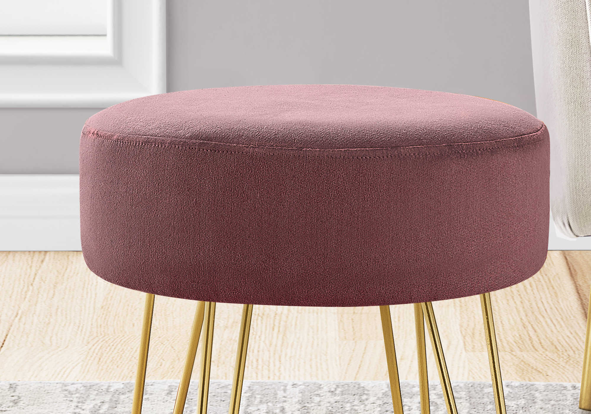 pink ottoman in boho living room