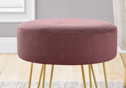 pink ottoman in boho living room