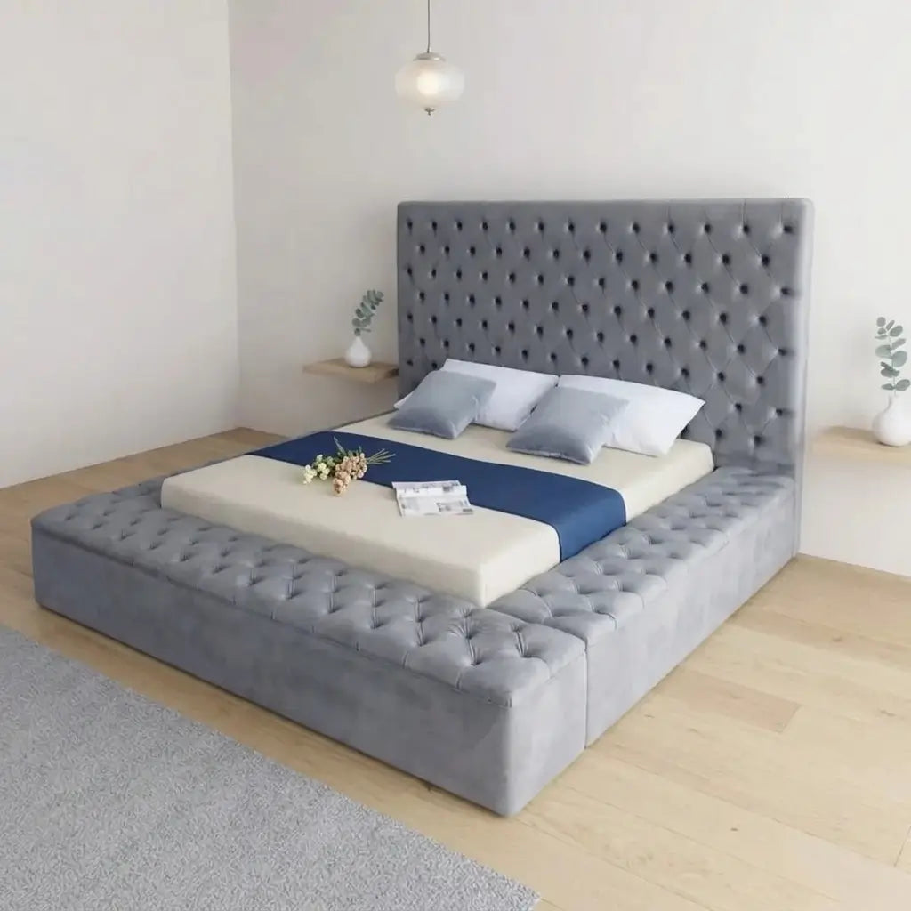 Diamond button-tufted grey velvet bed frame with thick side rails and footboard that open for hidden storage, styled in a bedroom