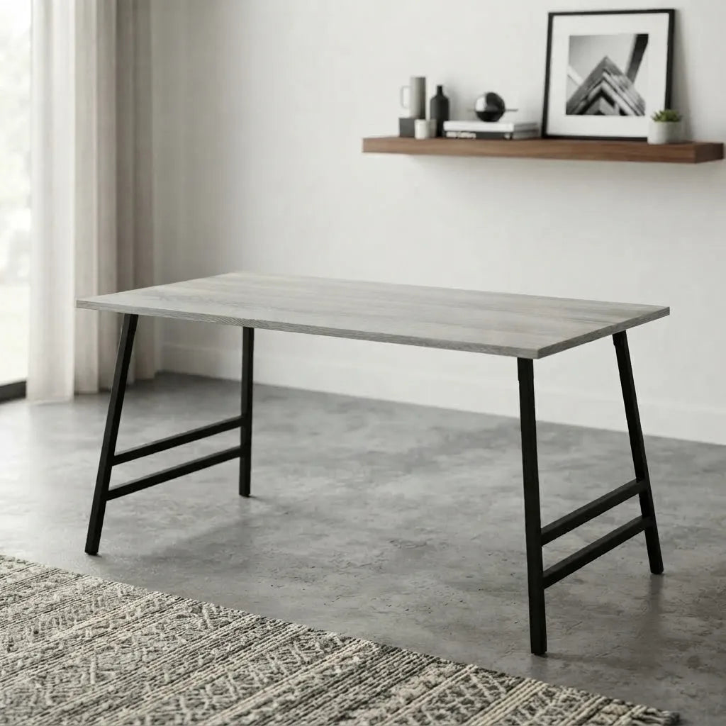 Modern dining table with gray wood-look tabletop and black metal legs, featuring a minimalist industrial design for a contemporary dining or workspace.