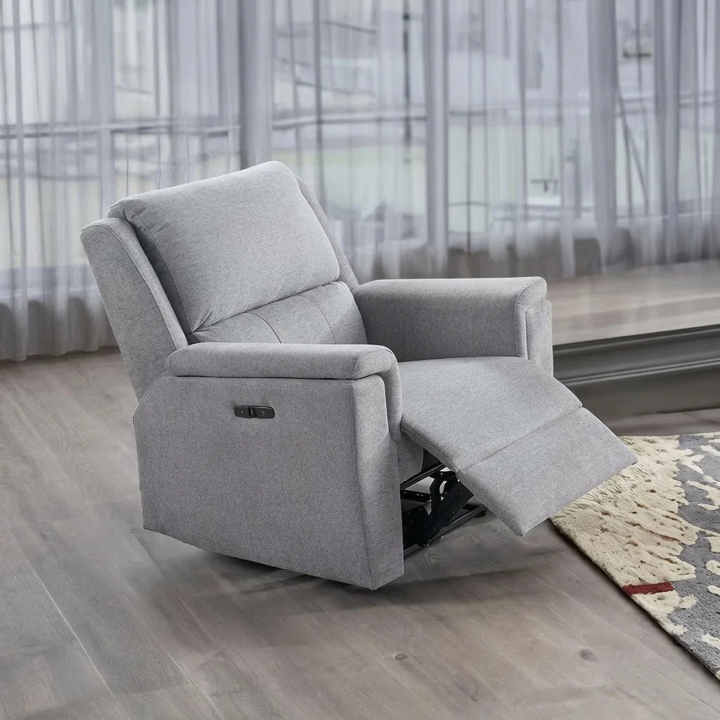 Light grey fabric power recliner armchair in semi-reclined position shown in a modern living room set